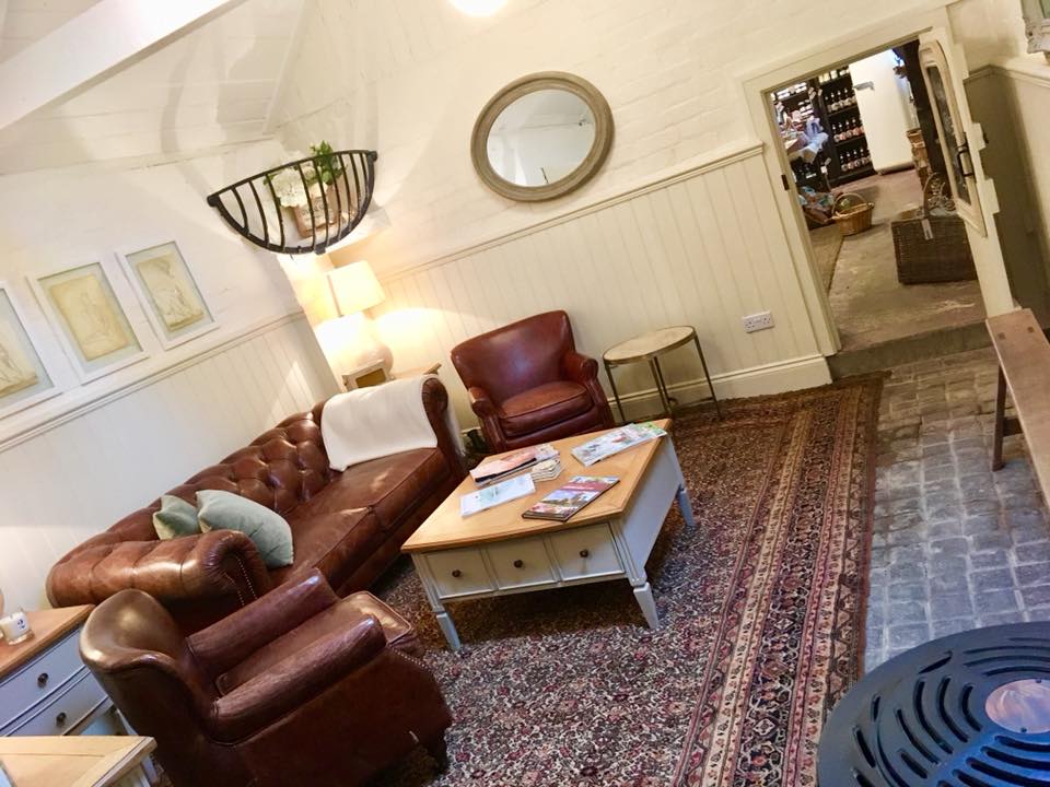 The relaxation lounge at The Dandelion Hideaway. Fitted out with leather sofas, rugs and warm coffee