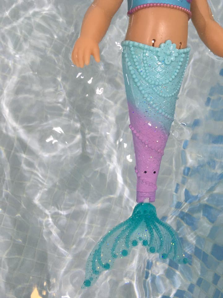 BABY Born Little sister mermaid in the water