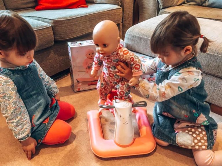 Twins playing with the Baby Annabell doll, walker and changing bag