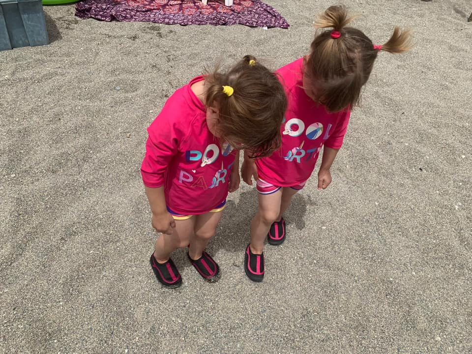 twins wearing their beach shoes