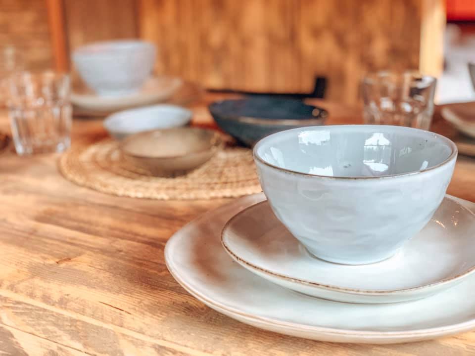 Plates set up on table ready for dinner