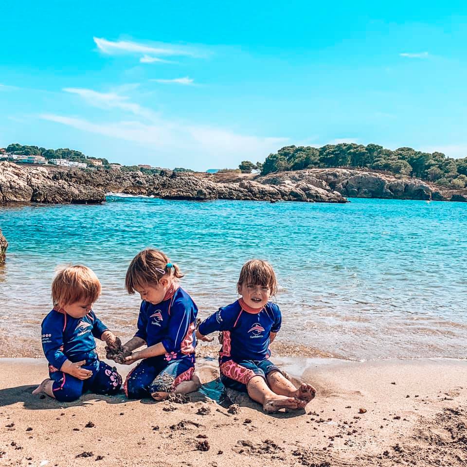 Children playing on the beach in the sand in Spain