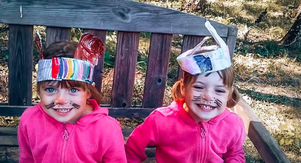 twins with rabbit hats on