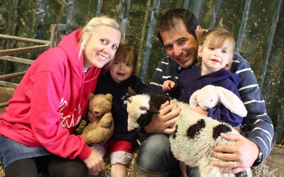 Family holding a lamb at North Bradbury Farm. A twin and toddler friendly holiday