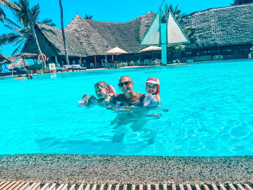 Two children and their mum in a swimming pool at Turtle Bay Resort Kenya