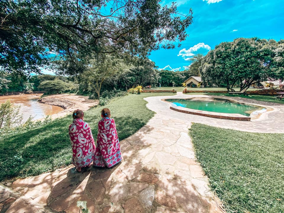 twins wrapped in towels overlooking the pool at House on the Wild