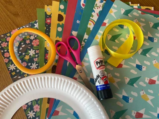 craft materials to make an Easter wreath. Paper plate, glue, scissors, craft paper