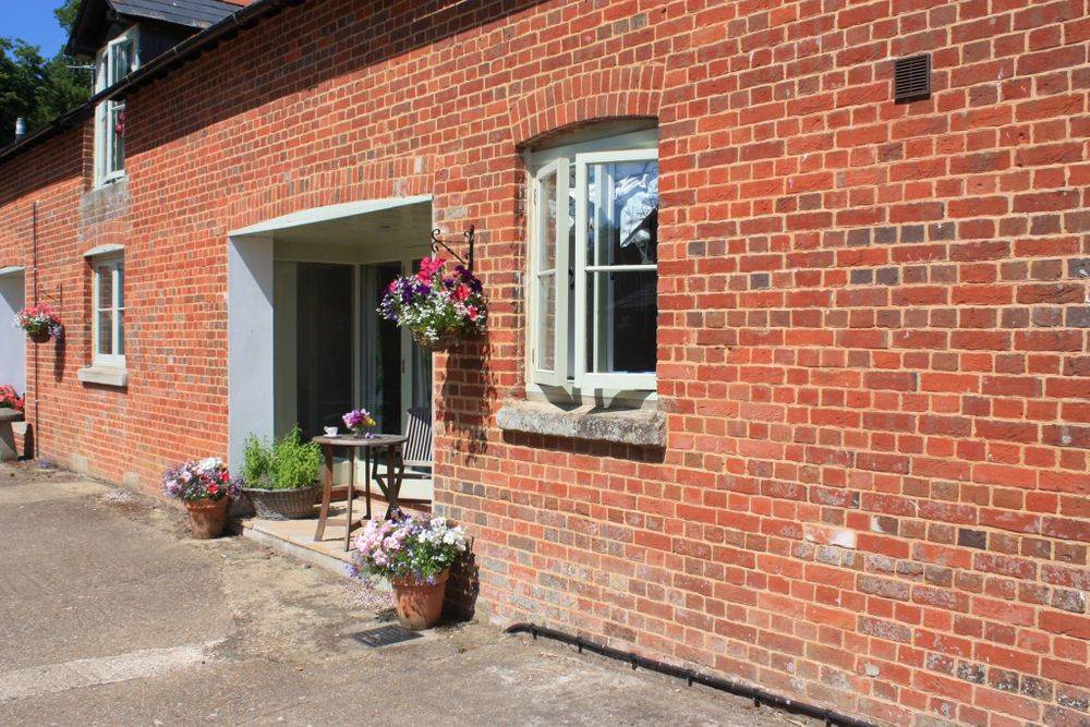 Image of the brick two story cottage at Kennel farm