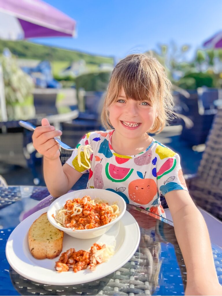 little girl eating dinner at Croyde Bay resort