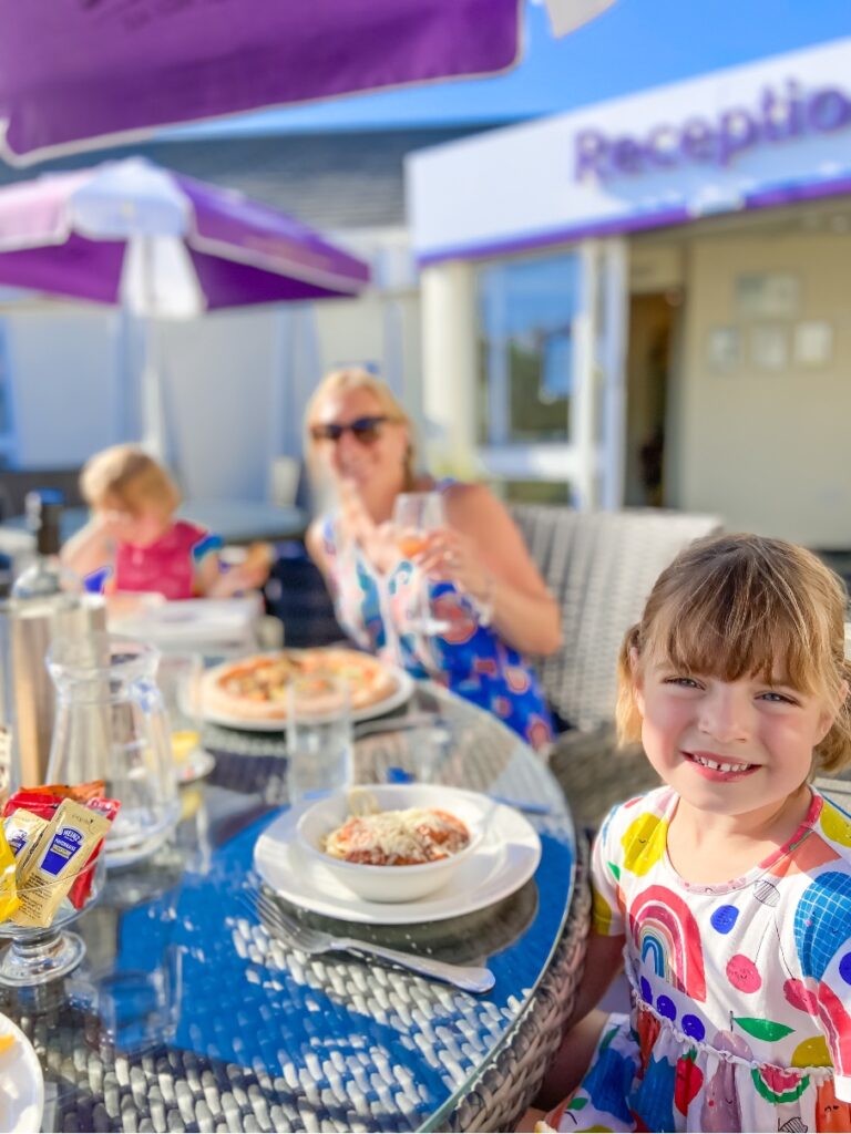 little girl eating dinner at Croyde Bay resort