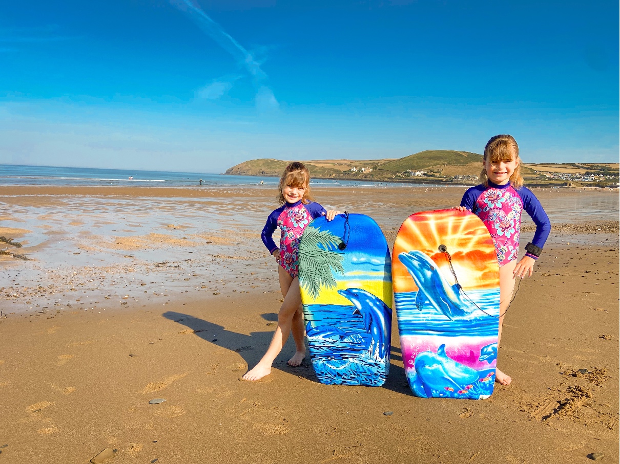 Croyde Bay surfing - 2 girls with surf boards