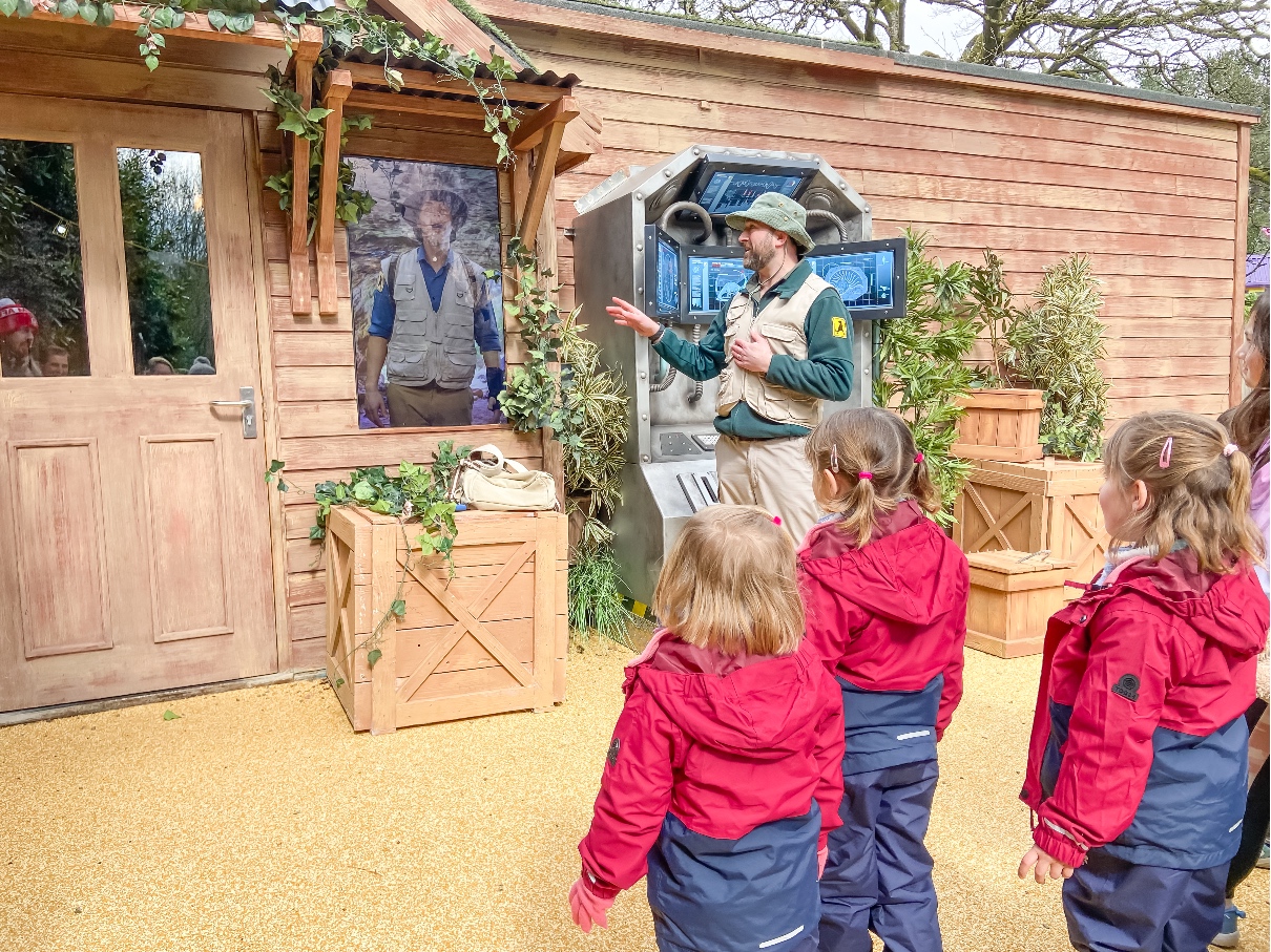 Alton Towers Cbeebies Land Andy's Dinosaur Dig with three girls watching Andy on a screen