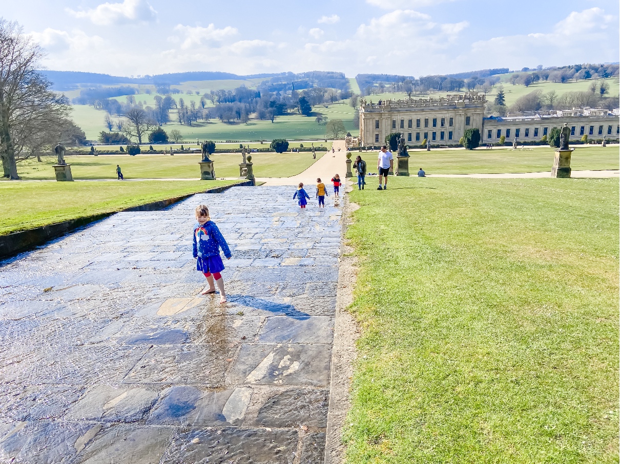 Chatsworth House Gardens three girls playing in Chatsworth House fountain