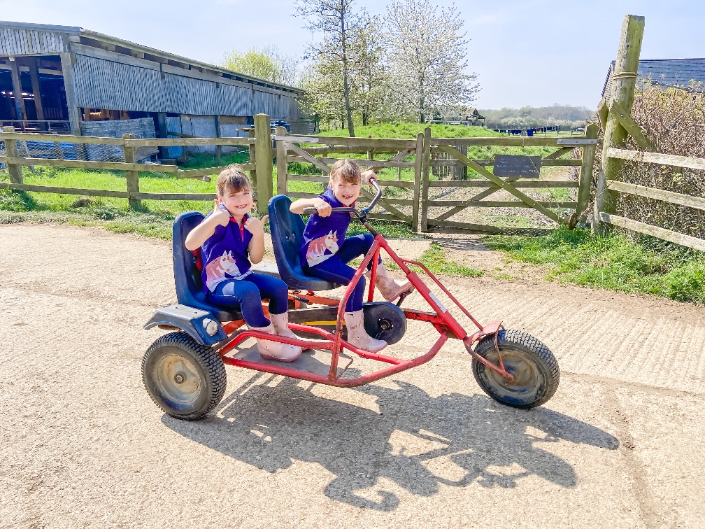 Glamping in Bedfordshire Featherdown a family on a go kart for 2