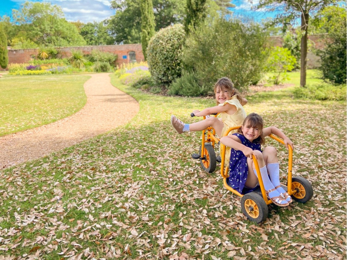 The Ickworth Hotel garden bikes with two girls cycling