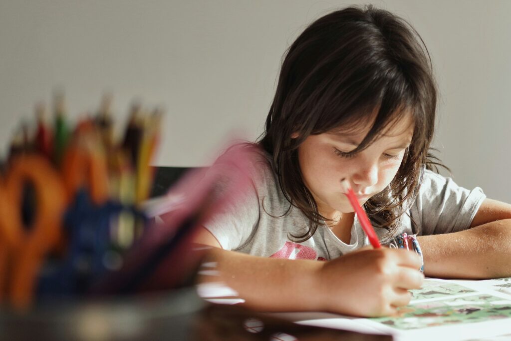 a girl writing concentrating on grammar